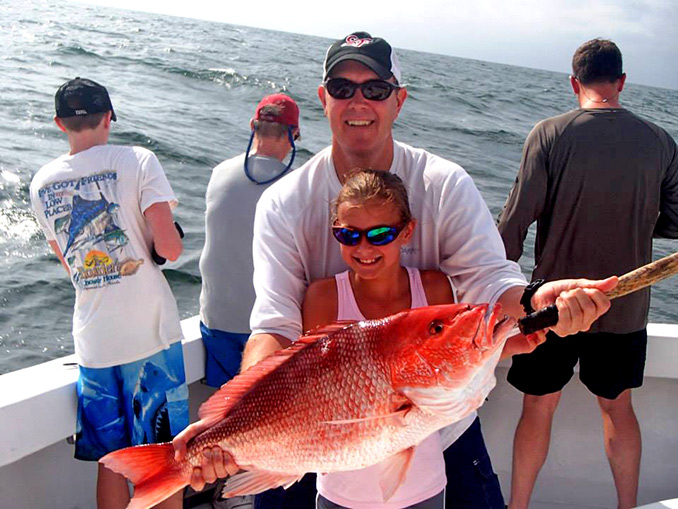 Dad and his girl... and one Huge fish! BITES ON!