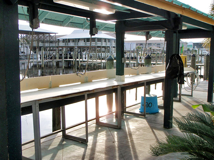 The fish cleaning stations are also available on the dock after your Gulf Shores deep sea fishing trip aboard the Intimidator charter boat.