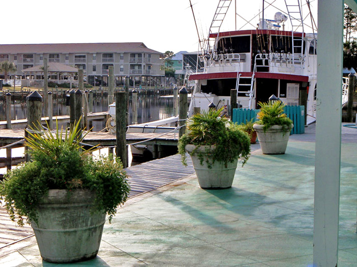 To the left you’ll see the charter boats docked and ready for your Gulf Shores deep sea fishing expedition.